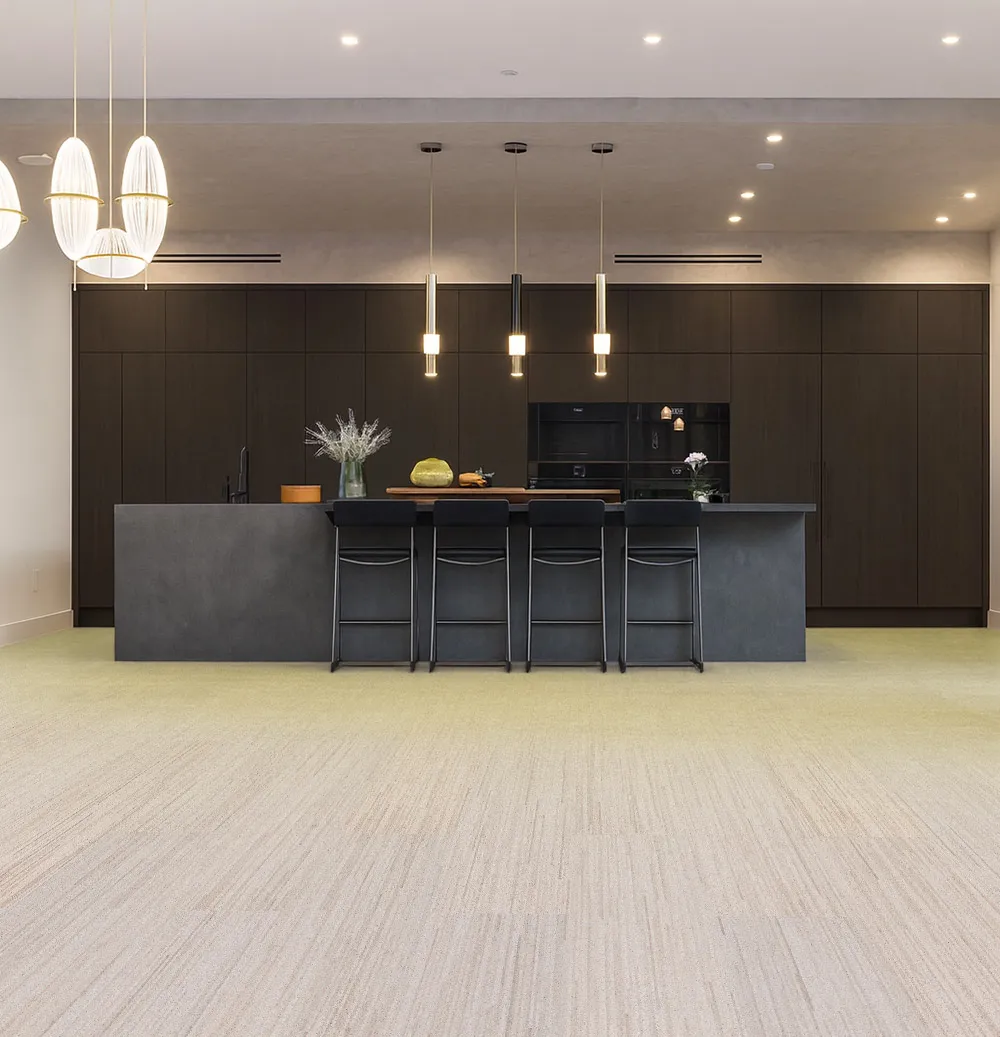 Vertical - 7/16" (11mm) - Swiss Real Cork Floating (FVtc11) Sophisticated kitchen with black cabinetry, pendant lighting, and Vertical Swiss cork flooring providing warmth, comfort, and a refined modern look.”