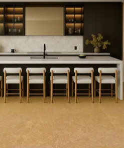 Stylish kitchen interior with a long island, soft lighting, and warm Desert Arable cork floors that add comfort and natural texture.