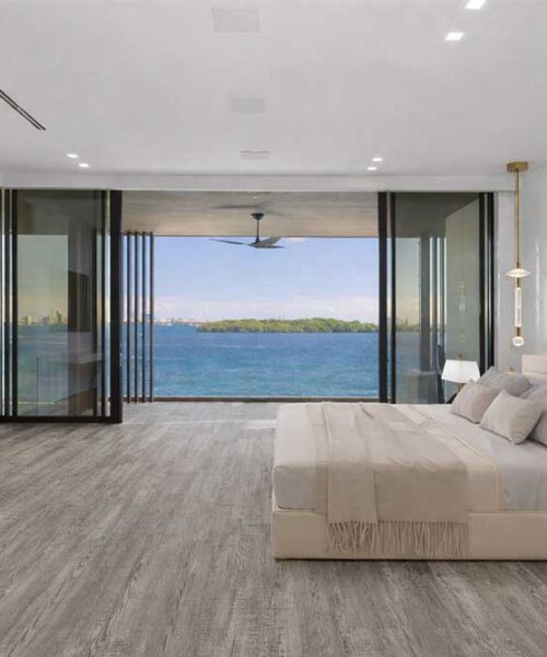 Earthy Pine - 3/8" (9.5mm) - Swiss Real Linoleum Hydrowood Core Waterproof Floating Flooring (NEthPin9.5) Warm Earthy Pine linoleum waterproof flooring creating a calm, modern hotel-style bedroom interior.