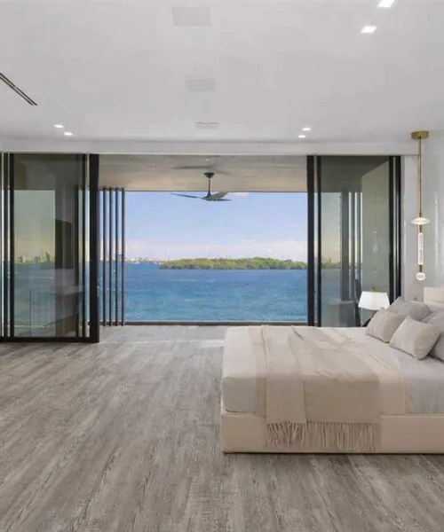 Earthy Pine - 3/8" (9.5mm) - Forna Natural Composite Flooring with Waterproof Hydrowood Core (NEthPin9.5) Warm Earthy Pine Natural Composite waterproof flooring creating a calm, modern hotel style bedroom interior.