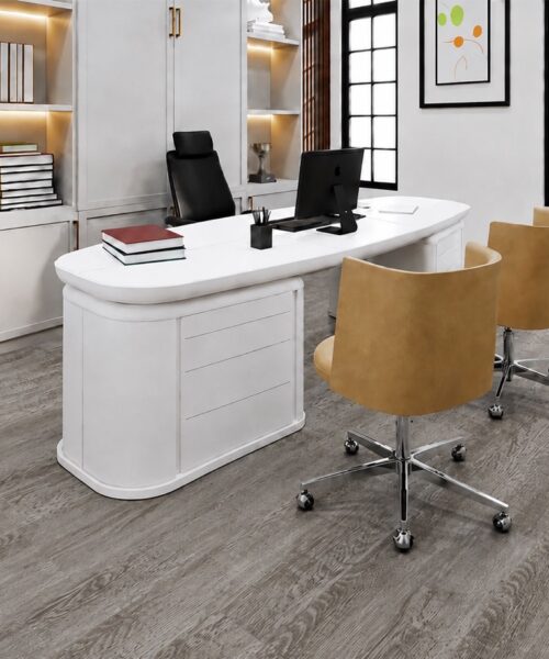 Swiss-made Earthy Pine Natural Composite Flooring shows soft gray pine grain beneath a white office desk.
