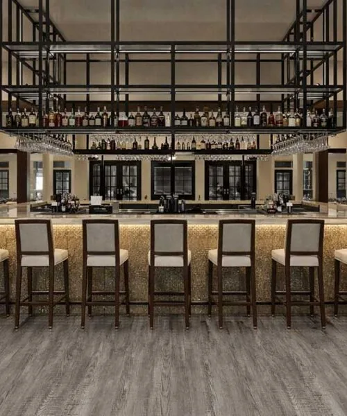Stylish bar interior using Earthy Pine waterproof Natural Composite Flooring for long lasting commercial durability.