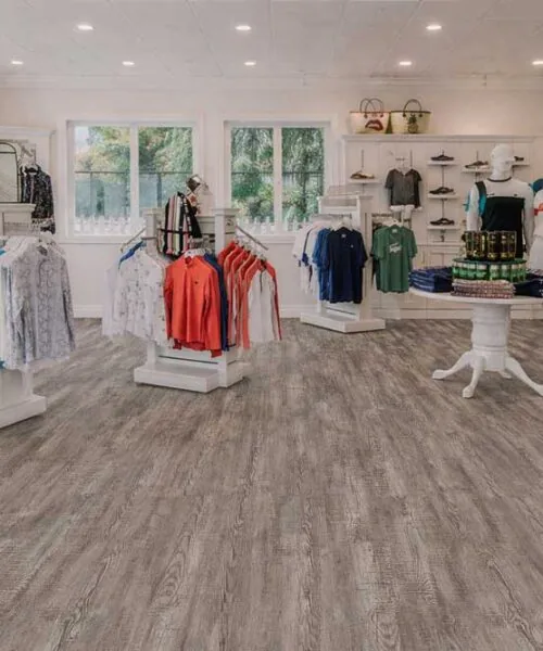Earthy Pine - 3/8" (9.5mm) - Forna Natural Composite Flooring with Waterproof Hydrowood Core (NEthPin9.5) Retail showroom featuring Earthy Pine Natural Composite Flooring, combining waterproof performance with natural wood aesthetics.
