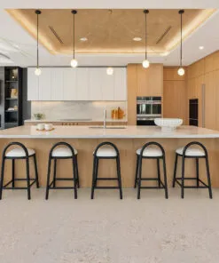 Modern kitchen featuring ceramic marble look cork flooring with island seating