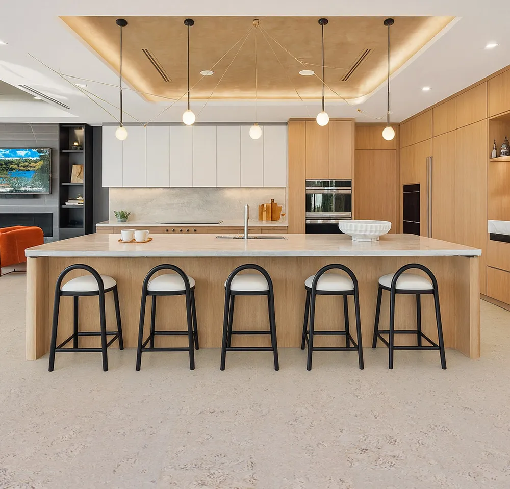 Modern kitchen featuring ceramic marble look cork flooring with island seating