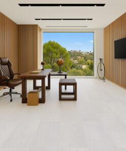 Executive office with wood wall panels and white leather cork floor.