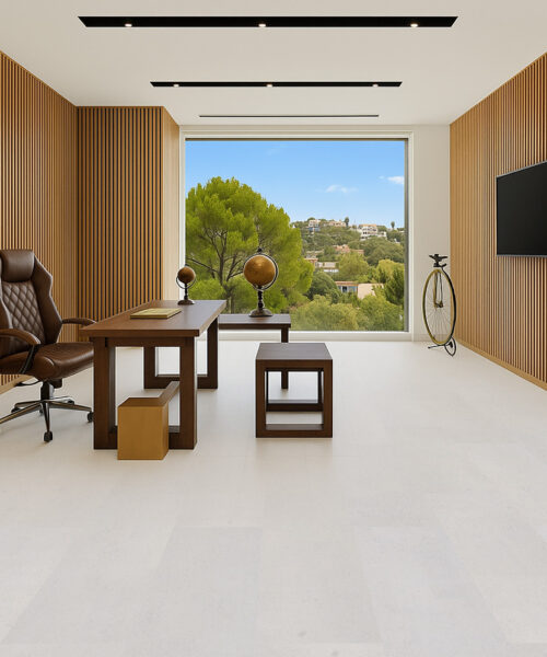 Executive office with wood wall panels and white leather cork floor.