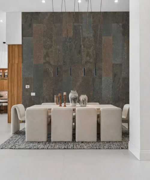 Gold Mica Slate stone tile feature wall in dining area showcasing layered natural textures and warm brown and gold tones