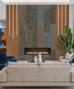 Modern fireplace wall clad in Gold Mica Slate stone tiles with natural variation and elegant vertical wood accents