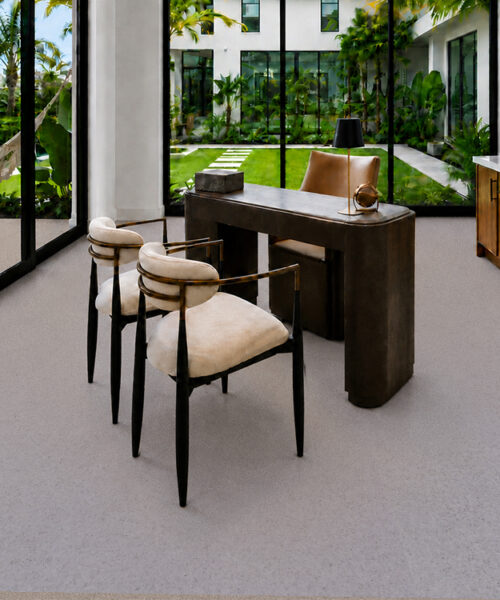 Grano 10mm natural cork flooring in gray-white tones complements a tropical garden-view home office.