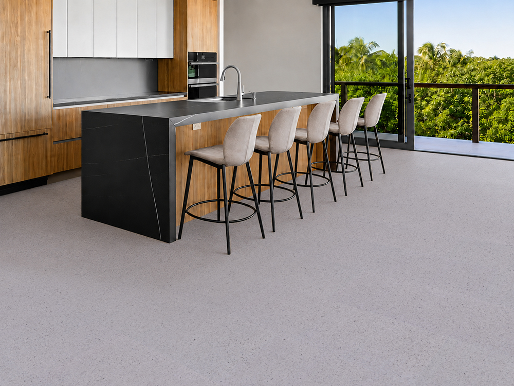 Grano - 25/64" (10mm) - Cork Floating (FGra10) Pale Grano cork floor planks with organic grain surround a modern kitchen island and five stools.