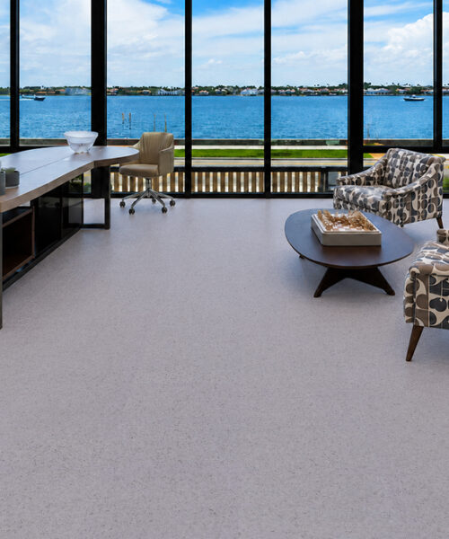 Grano - 25/64" (10mm) - Cork Floating (FGra10) Grano sustainable cork flooring with a soft speckled surface fills a bright waterfront office and lounge.