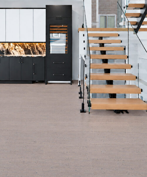 Gray Bamboo - 1/2" (12mm) - Cork Floating (FGB12) Gray Bamboo warm taupe cork flooring with subtle linear grain brightens an entryway beside an open staircase.