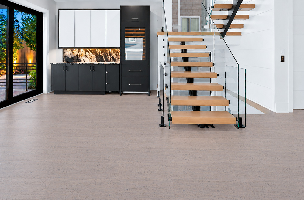 Gray Bamboo - 1/2" (12mm) - Cork Floating (FGB12) Gray Bamboo warm taupe cork flooring with subtle linear grain brightens an entryway beside an open staircase.