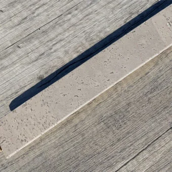 Gray leather cork flooring t molding transition threshold.