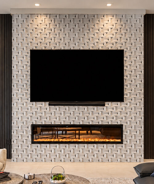 hite 3D cork wall tiles in an interlocking woven pattern create a modern TV feature wall with a linear fireplace and dark wood accents.