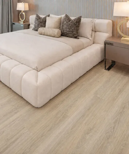 Hamilton light beige cork floating flooring in a luxury bedroom with a cream upholstered bed