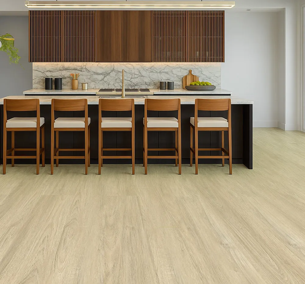 Elegant kitchen with Hamilton Swiss Cork floating flooring in a light oak finish, complemented by a marble island, wood cabinetry, and matching bar stools in a bright open-concept layout