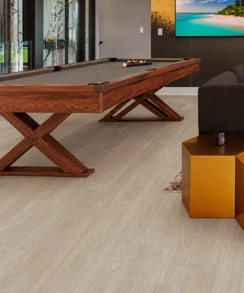 Hamilton - 7/16" (11mm) - Swiss Design Cork Floating (FHam11) Hamilton warm gray cork floating floor in a modern game room with a wooden pool table