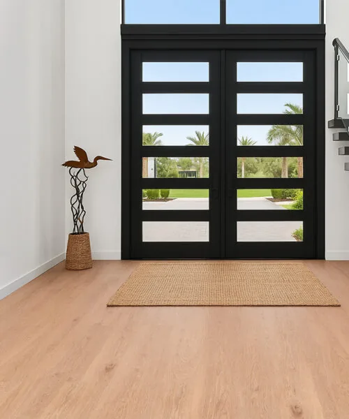 Honey Oak - 3/8" (9.5mm) - Forna Natural Composite Flooring with Waterproof Hydrowood Core (NHonO9.5) Front entrance with Honey Oak Forna Natural Composite flooring and black framed glass doors