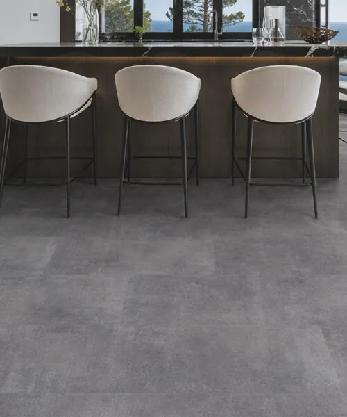 Ndustrial Grey concrete look Natural Composite Flooring in a modern indoor outdoor living space