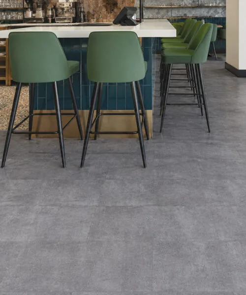 Industrial Grey Natural Composite Flooring installed in a commercial café and bar interior