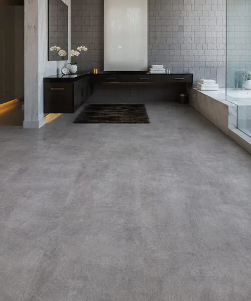 Industrial Grey Forna Natural Composite Flooring in a modern bathroom with a concrete look surface