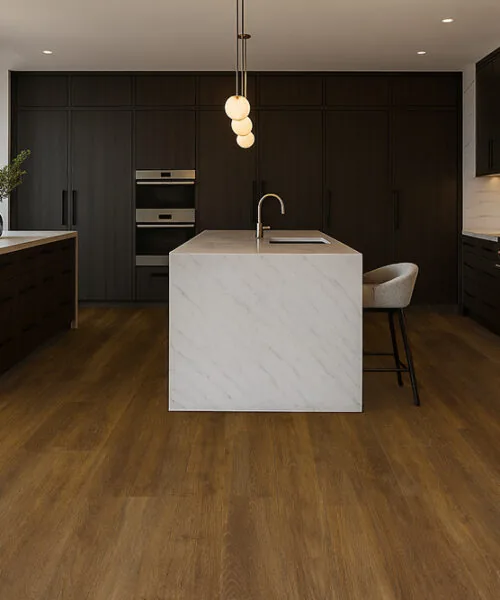 Latte Swiss cork floating floor in a high-end kitchen with marble island and dark cabinetry