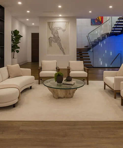 Latte - 7/16" (11mm) - Swiss Design Cork Floating (FLat11) Latte Swiss cork flooring in a warm modern living room with neutral seating and fireplace