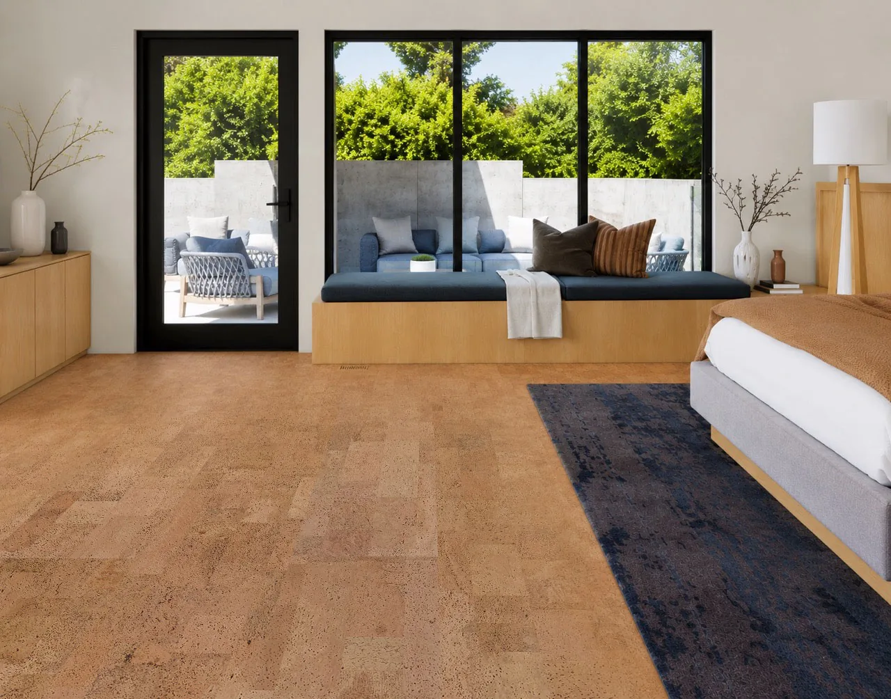 Leather - 1/2" (12mm) - Cork Floating (FLe12) Modern bedroom featuring Leather Natural 12mm cork floating flooring with a cozy window seat, large black-framed windows, and warm natural cork texture.