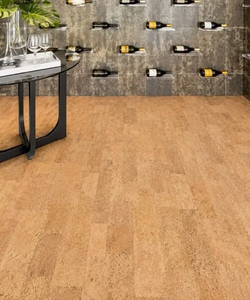 Leather - 1/2" (12mm) - Cork Floating (FLe12) Luxury wine cellar showcasing Leather Natural cork floating flooring paired with stone walls and contemporary wine display racks.