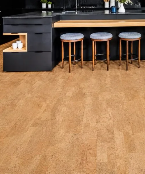 Leather - 1/2" (12mm) - Cork Floating (FLe12) Contemporary black kitchen with a spacious island, wood accents, and warm Leather Natural cork floating flooring.