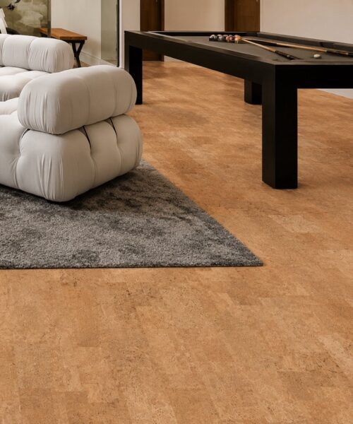 Spacious entertainment room featuring Leather Natural cork flooring, a pool table, and comfortable modern seating.