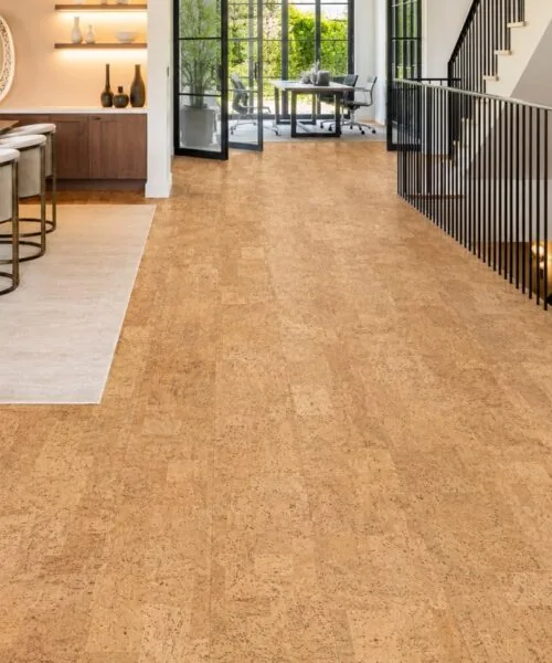 Leather - 1/2" (12mm) - Cork Floating (FLe12) Bright open-concept dining area featuring Leather Natural cork flooring, modern staircase, and large glass doors.