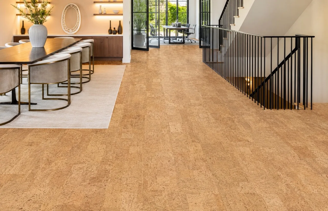 Leather - 1/2" (12mm) - Cork Floating (FLe12) Bright open-concept dining area featuring Leather Natural cork flooring, modern staircase, and large glass doors.