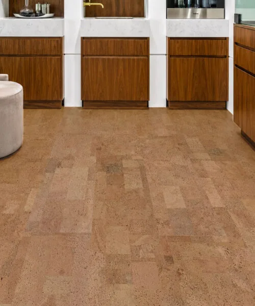 Leather - 1/2" (12mm) - Cork Floating (FLe12) Elegant walnut kitchen showcasing Leather Natural cork flooring, marble countertops, and premium wood cabinetry.