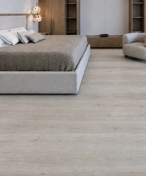 Spacious bedroom with light grey oak cork planks and contemporary neutral decor