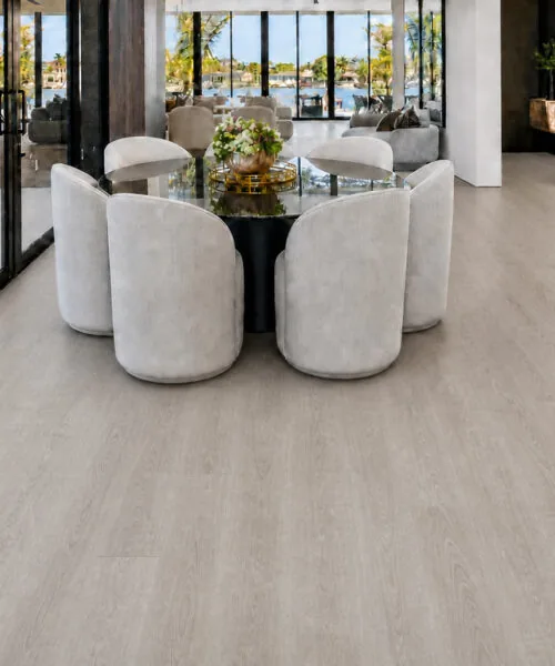 Light Grey Oak - 13/32" (10.5mm) - Design Cork Floating (FLG10.5) Open dining area with light grey oak cork planks, glass walls, and waterfront views