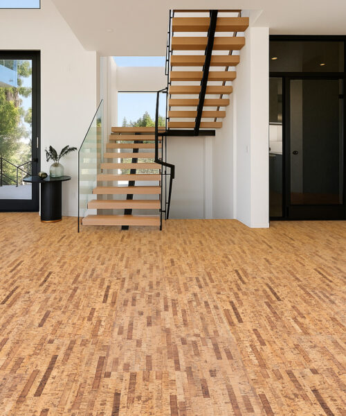 Contemporary entryway with floating staircase installed over Linea Dark Swiss cork flooring for a clean modern aesthetic.