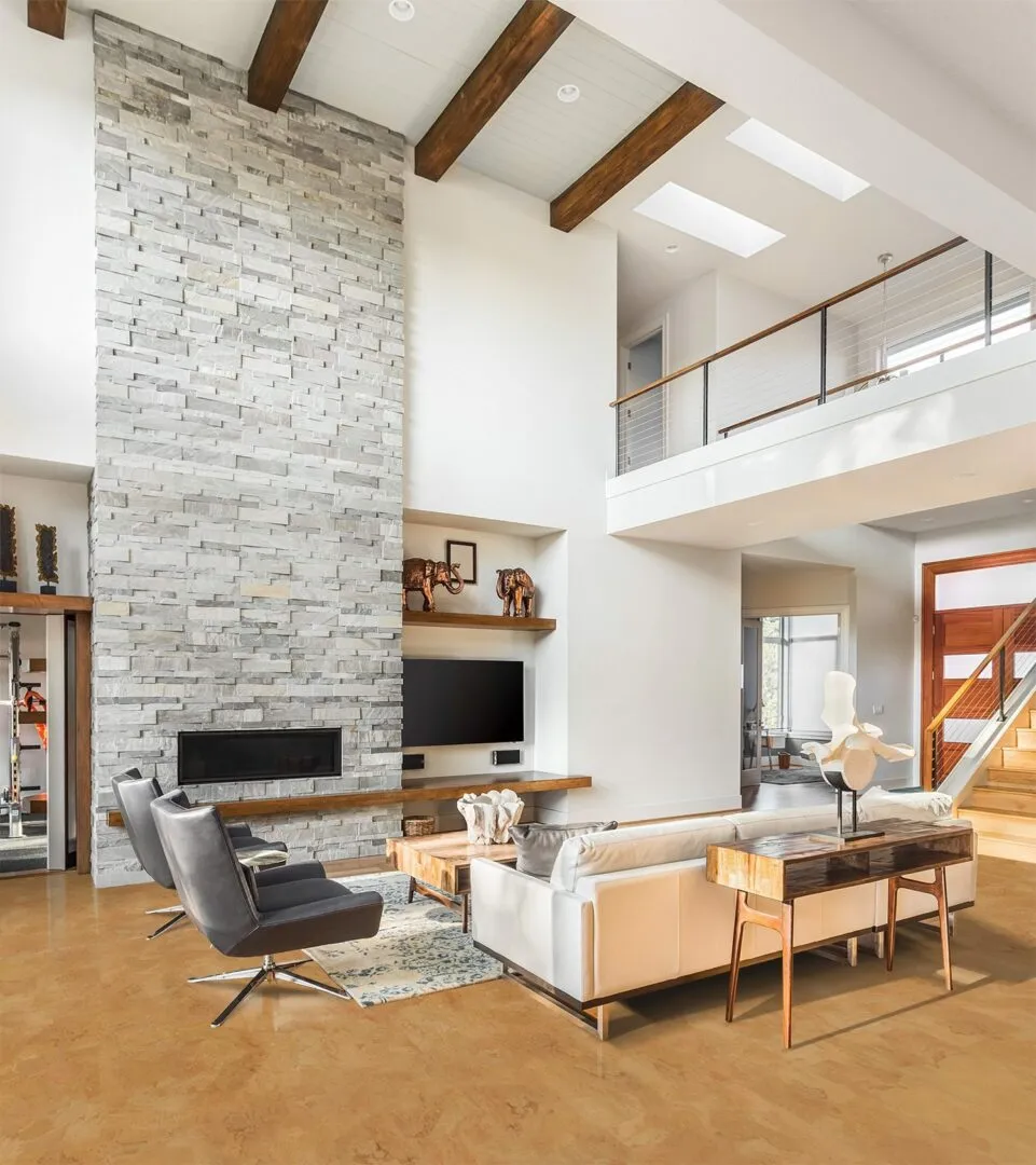 logan beautiful living room with foran cork floors and fireplace in new luxury home