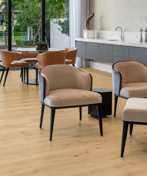 Long Beach - 7/16" (11mm) - Swiss Design Floating (FLB11) Wide-plank Long Beach Swiss Design cork flooring in a luxury waterfront office with floor-to-ceiling windows, designer desk, and natural daylight.