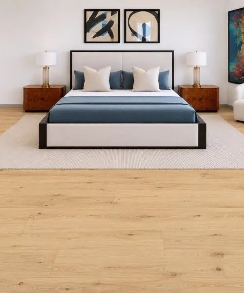 Long Beach Swiss Design 11mm cork floating floor adds warmth to a contemporary master bedroom featuring an upholstered bed, modern artwork, and elegant décor.