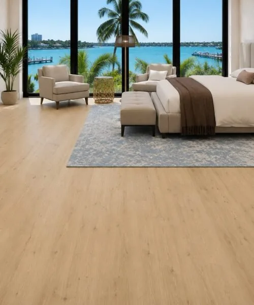 Luxury bedroom with Long Beach Swiss Design cork floating flooring, soft neutral décor, plush area rugs, and contemporary furnishings overlooking the waterfront.