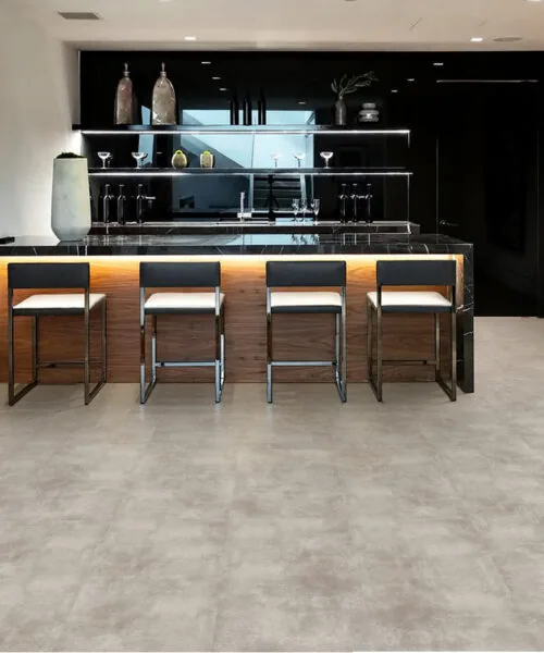 Copperstone Gray - 3/8" (9.5mm) - Forna Natural Composite Flooring with Waterproof Hydrowood Core (NCopG9.5) Luxury minimalist kitchen featuring Copperstone Gray waterproof Natural Composite basement flooring for a seamless look.