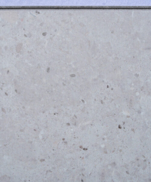 Matera Blend Swiss Techslate flooring with a light limestone stone appearance, featuring soft grey tones and subtle natural mineral detailing for modern residential and commercial spaces.