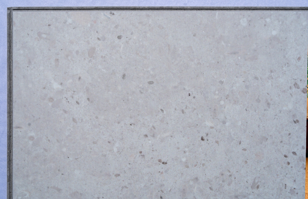 Matera Blend -19/64" (7.5mm) - Swiss Techslate (MMatBd7.5) Matera Blend Swiss Techslate flooring with a light limestone stone appearance, featuring soft grey tones and subtle natural mineral detailing for modern residential and commercial spaces.