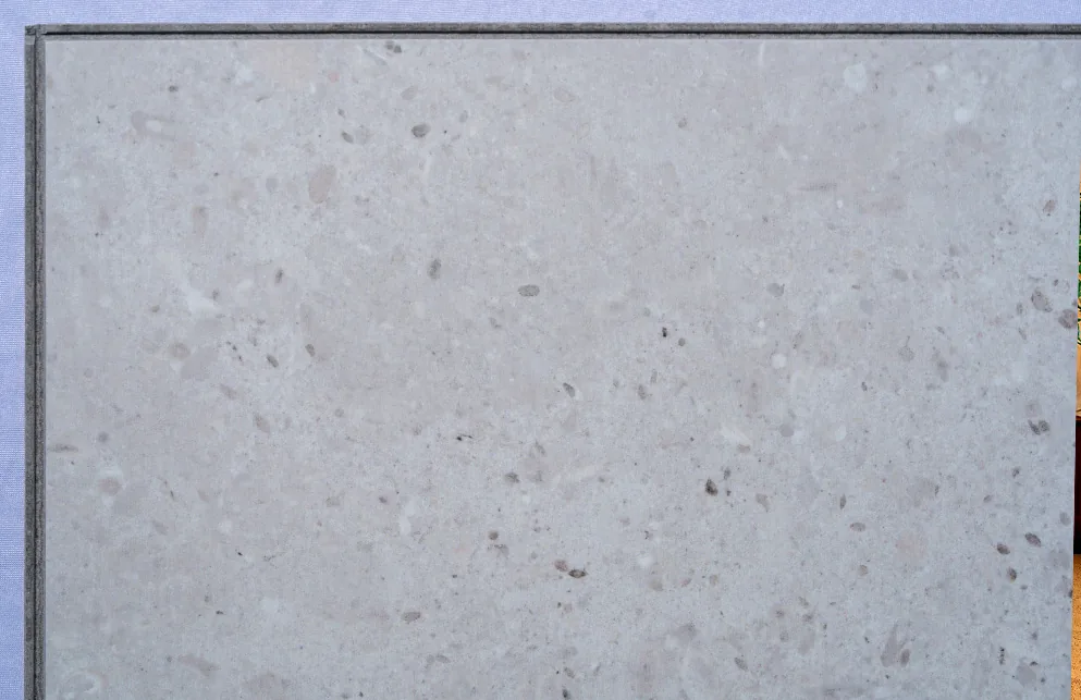 Matera Blend -19/64" (7.5mm) - Swiss Techslate (MMatBd7.5) Matera Blend Swiss Techslate flooring with a light limestone stone appearance, featuring soft grey tones and subtle natural mineral detailing for modern residential and commercial spaces.