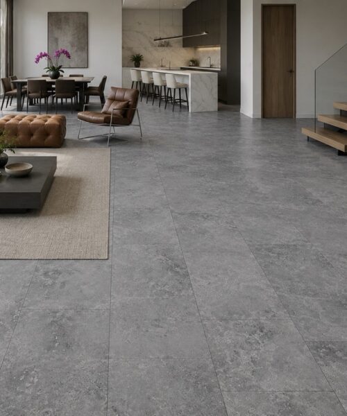 Midnight Slate TechSlate flooring shows large-format gray stone-look planks throughout an open-plan living room, dining area, kitchen, and staircase.