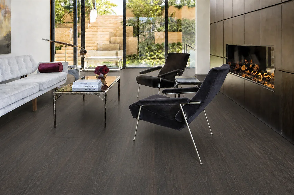 Mocha - 7/16" (11mm) - Swiss Design Cork Floating (FMoc11) Elegant living room with dark Mocha cork floors, a modern fireplace, and floor-to-ceiling windows.