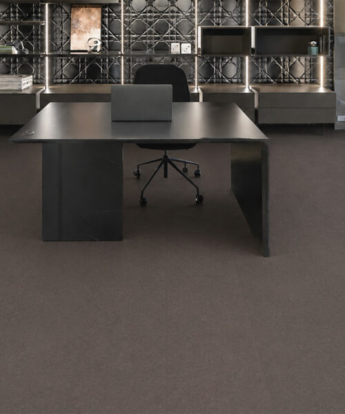 Night - 7/16" (11mm) - Swiss Real Cork Floating (FNig11) Dark Night cork flooring for an office creates a smooth plank layout beneath contemporary black furniture.